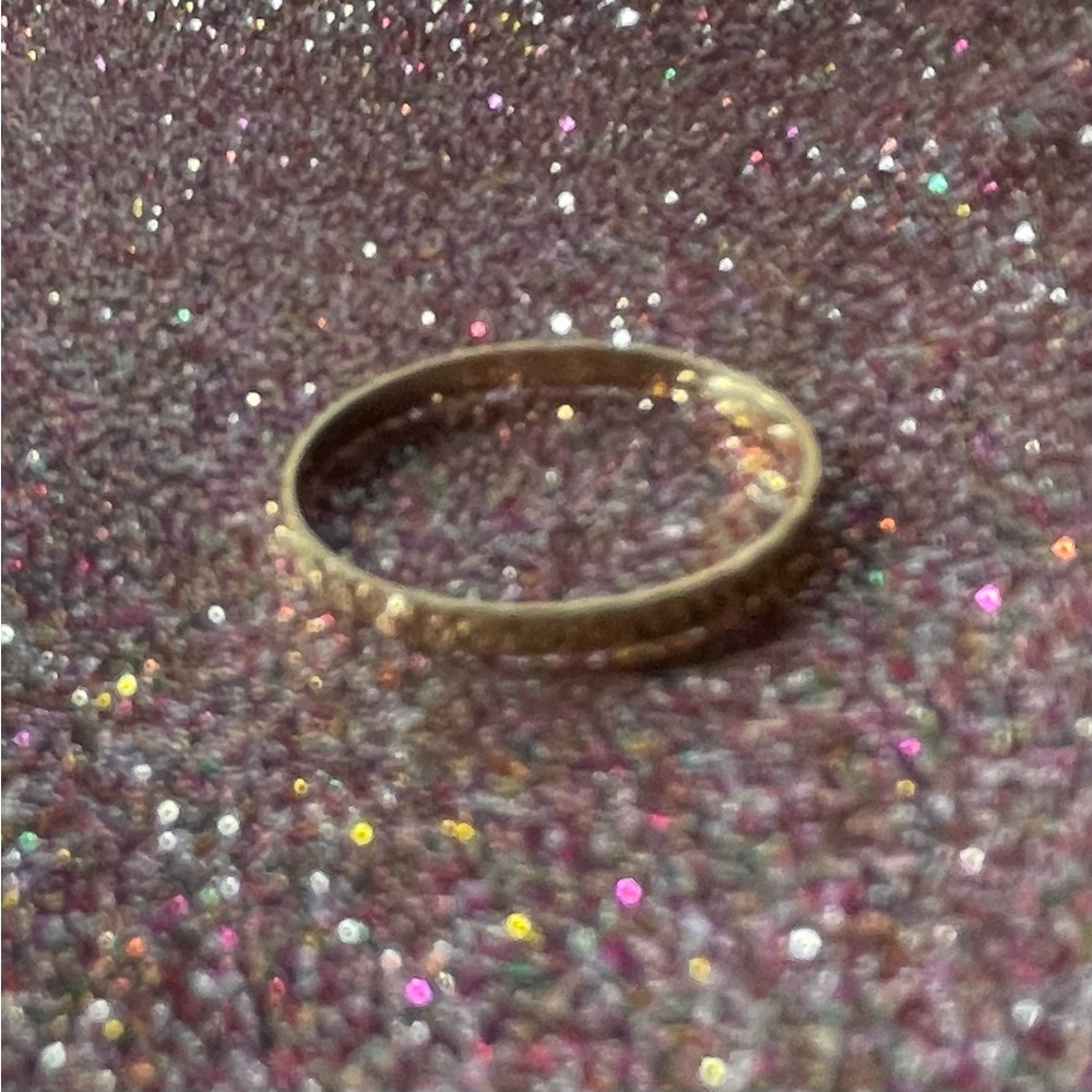 14K gold ring, quite thin, but really shiny.